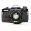 Used Olympus OM-4 Ti 35mm SLR with 50mm lens, black