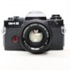 Used Olympus OM-4 Ti 35mm SLR with 50mm lens, black
